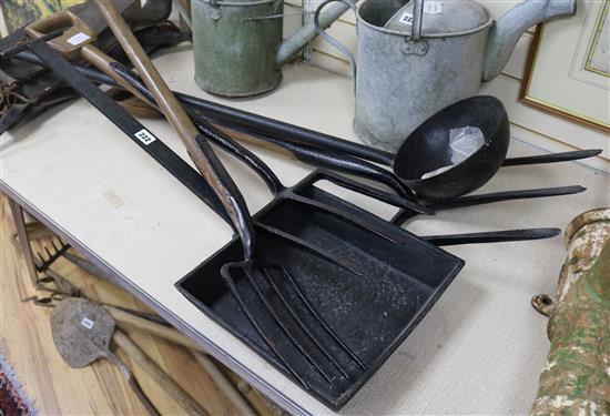 An iron oasthouse brinstone pan, a long handled iron ladle, a hop spud fork and two three pronged forks